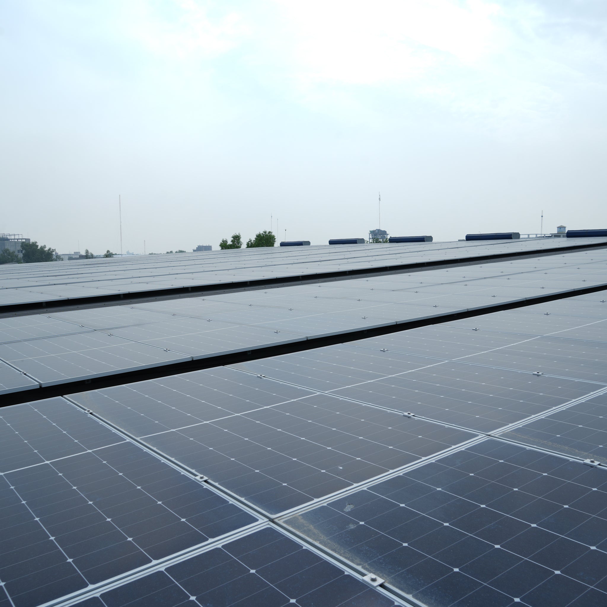 Solar panels installed across a textile facility roof